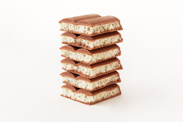 Tasty porous chocolate on white background. White aerated chocolate