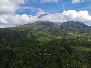 Obraz premium Aerial view of Mount Merapi Landscape with rice field and village in Yogyakarta, Indonesia Volcano Landscape View.