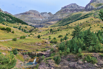 Fototapeta na wymiar Landscape with waterfall in the Igüer Valley, Huesca, Spain