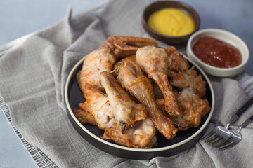 fresh crispy Korean fried chicken with two sources.