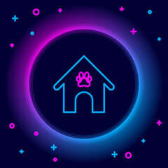 Glowing neon line Dog house and paw print pet icon isolated on black background. Dog kennel. Colorful outline concept. Vector.