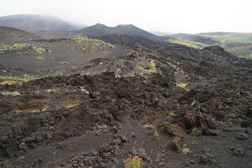 Mount Etna volcanic landscape on side craters, guided hiking tour on Etna, Sicily, Italy