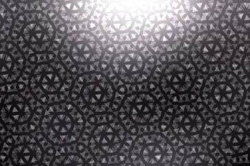 Curl geometric ornament cover dark metal polished background. Black shimmering texture abstract pattern.