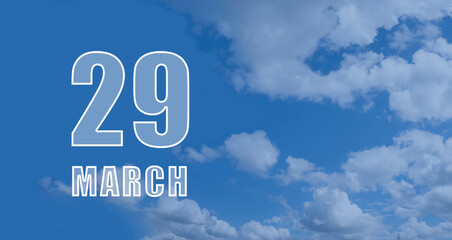 march 29. 29-th day of the month, calendar date. White numbers against a blue sky with clouds. Copy space, Spring month, day of the year concept