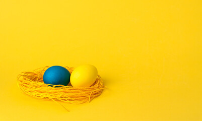 painted chicken eggs on a yellow background. Easter eggs. copyspace