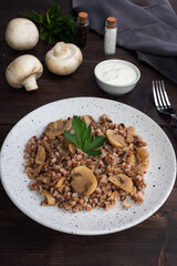 Boiled buckwheat with stewed mushrooms. Russian traditional food. Healthy diet food.