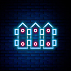 Glowing neon line Garden fence wooden icon isolated on brick wall background. Colorful outline concept. Vector.