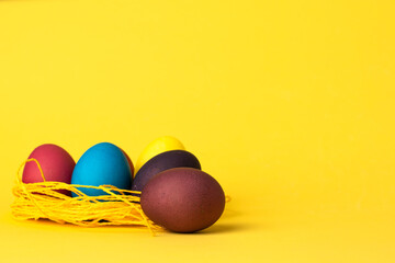 painted chicken eggs on a yellow background. Easter eggs. copyspace