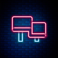 Glowing neon line Sauna wood bench icon isolated on brick wall background. Colorful outline concept. Vector.