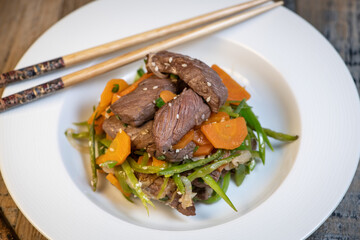 Preparing Recipe Sesame beef wok, minced summer vegetables
