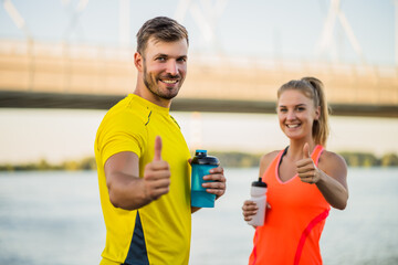 Happy young couple is ready for exercising outdoor.