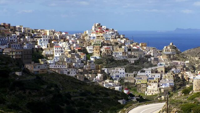 Karpathos Greece the village of Olympos built on the mountains and very often in the clouds with the very special architecture of his houses as if hanging from cliffs Time Lapse