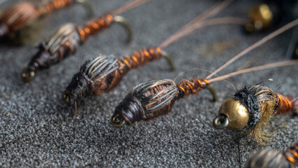 The inside of a fisherman's flybox, with an assortment of hand-tied trout flies.