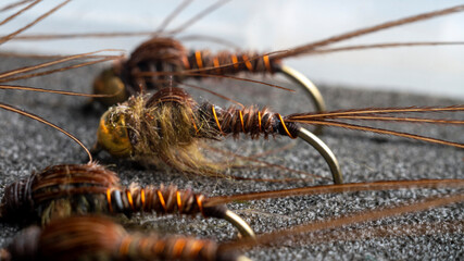 Macro. The inside of a fisherman's flybox, with an assortment of hand-tied trout flies.