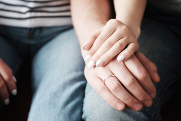 Hands of a man and a woman close up - Affectionate relationship between husband and wife.