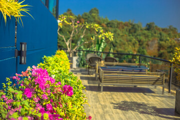 Obraz premium Panoramic nature background (mountains, sea, trees, twilight lights in the sky, waterfront communities), naturally blurred through the wind, seen on tourist spots or scenic spots