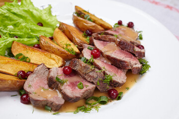 Tasty roasted pork meat with potatoes