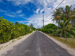 Main road in a tropical remote island (Rangiroa, Tuamotu Islands, French Polynesia in 2012)