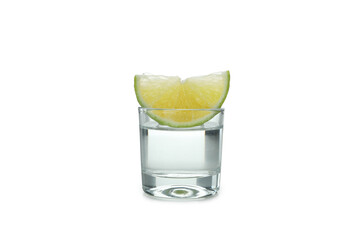 Shot of vodka and lime slice isolated on white background