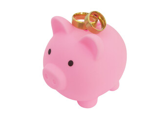 Save money for wedding and planning wedding concept. Piggy bank and wedding rings isolated on white.