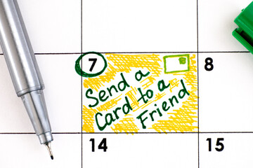 Reminder Send a Card to a Friend Day in calendar with pen