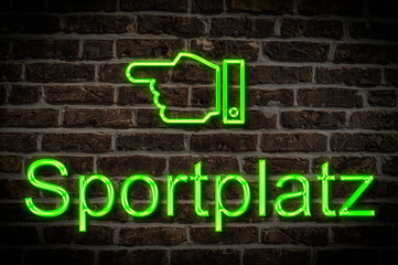 Fototapeta premium Leuchtreklame Sportplatz