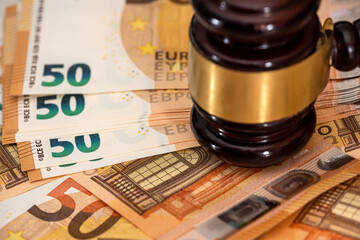 Wooden gavel for judge lawyer on 50 Euro bills