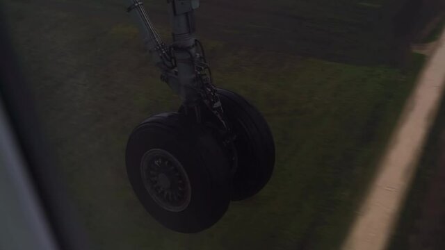 Airplane landing gear down deployed flying to runway dense fog rain zero visibility instrument flight approach ground for landing