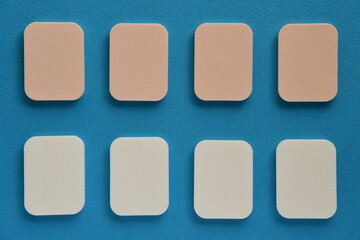Makeup sponge isolated on blue background.