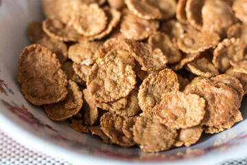 whole grain cereal close-up in a plate for breakfast