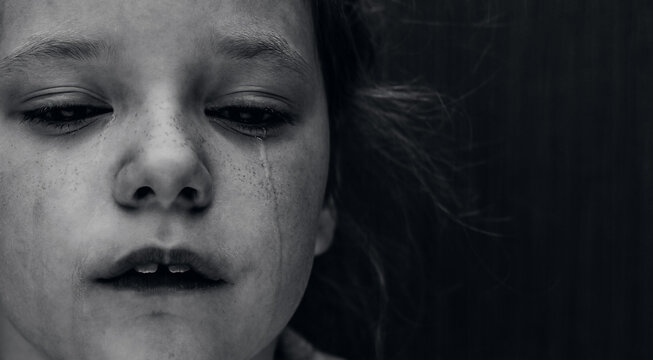 Dramatic photo of a crying kid