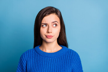 Fototapeta premium Portrait of young lovely pretty attractive minded thoughtful girl thinking look copyspace isolated on blue color background