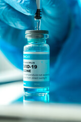 Medical concept ampoules or vials with Covid-19 vaccine on a laboratory bench