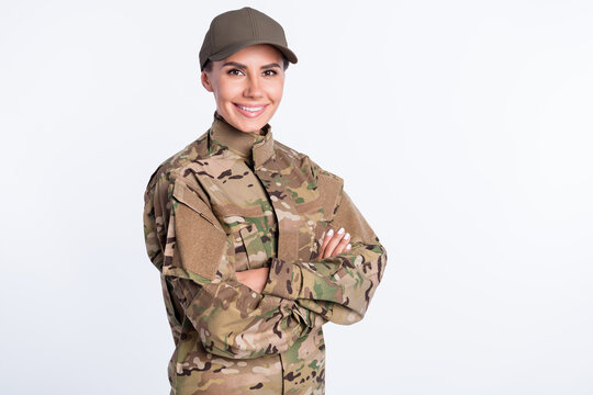 Profile side photo of young woman happy smile soldier army officer crossed hands uniform isolated over white color background