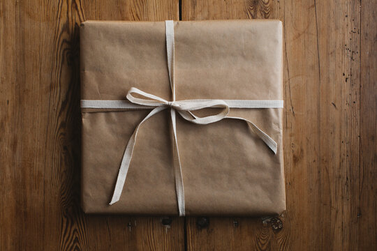Packed present on wooden background