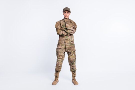 Full length photo of young woman confident crossed hands soldier officer army camouflage uniform isolated over white color background