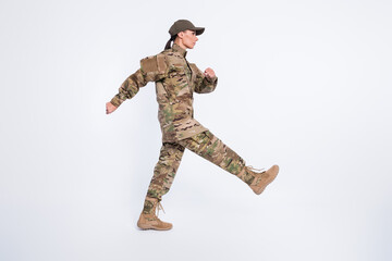 Full length profile photo of focused young person look empty space marching isolated on white color...