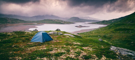 Wild camping with a tent in northern Europe traveling in Scandinavia, a national park in Norway, a...