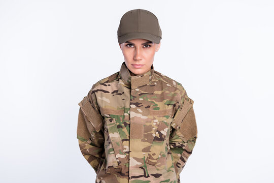 Photo of confident young military girl look attentively camera calm face isolated on white color background