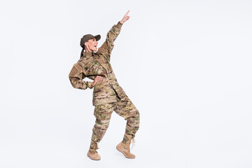 Full length photo of excited cheerful person look pointing finger empty space enjoy disco isolated...