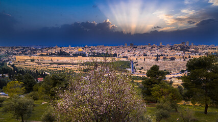 Beautiful dramatic spring sunset over Jerusalem, with Mount Zion, the Old City, the Dome of the...