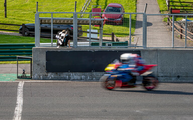 Fototapeta premium A shot of a racing motorbike as it circuits a track.