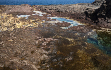 Gran Canaria, calm natural seawater pools in under the steep cliffs of the north coast and separated from the ocean by volcanic rocks,
Sardina del Norte area
