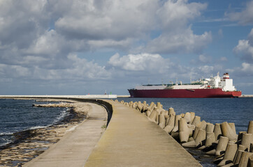 SEA PORT BREAKWATER - Strengthening protection of the sea coast and a gas tanker in background
