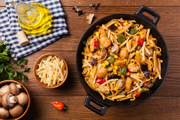 Indonesian pasta with chicken, pieces of bamboo and mushrooms.