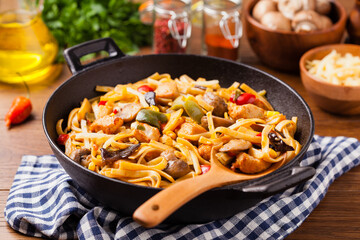 Indonesian pasta with chicken, pieces of bamboo and mushrooms.