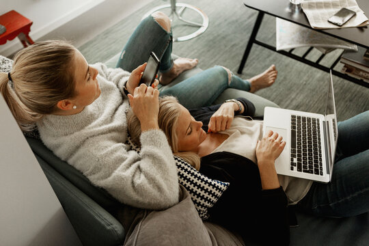 Two women relaxing in living room