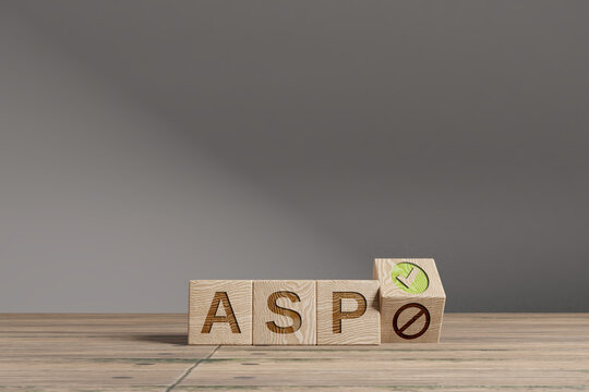 Wood cubes with acronym 'ASP' on a beautiful wooden table, studio background. Business concept and copy space.