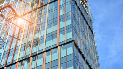 High-rise building under construction. Modern office building. Sunrise.