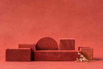 Minimalist natural background for cosmetic products. Terracotta wooden podiums, dry flower and...